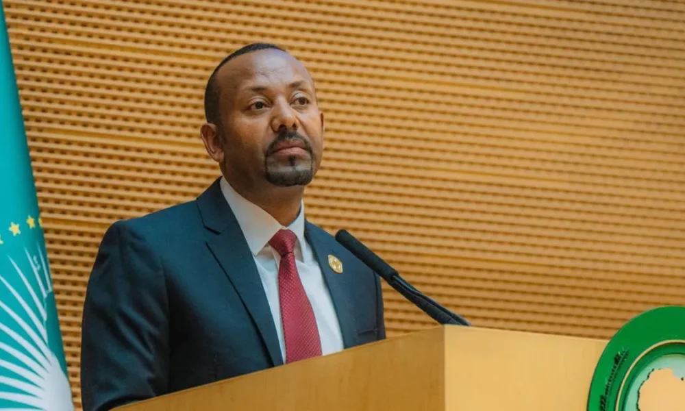 Prime Minister Abiy Ahmed delivering a speech on Ethiopia's maritime access and digital transformation at the African Union Summit in Addis Ababa.